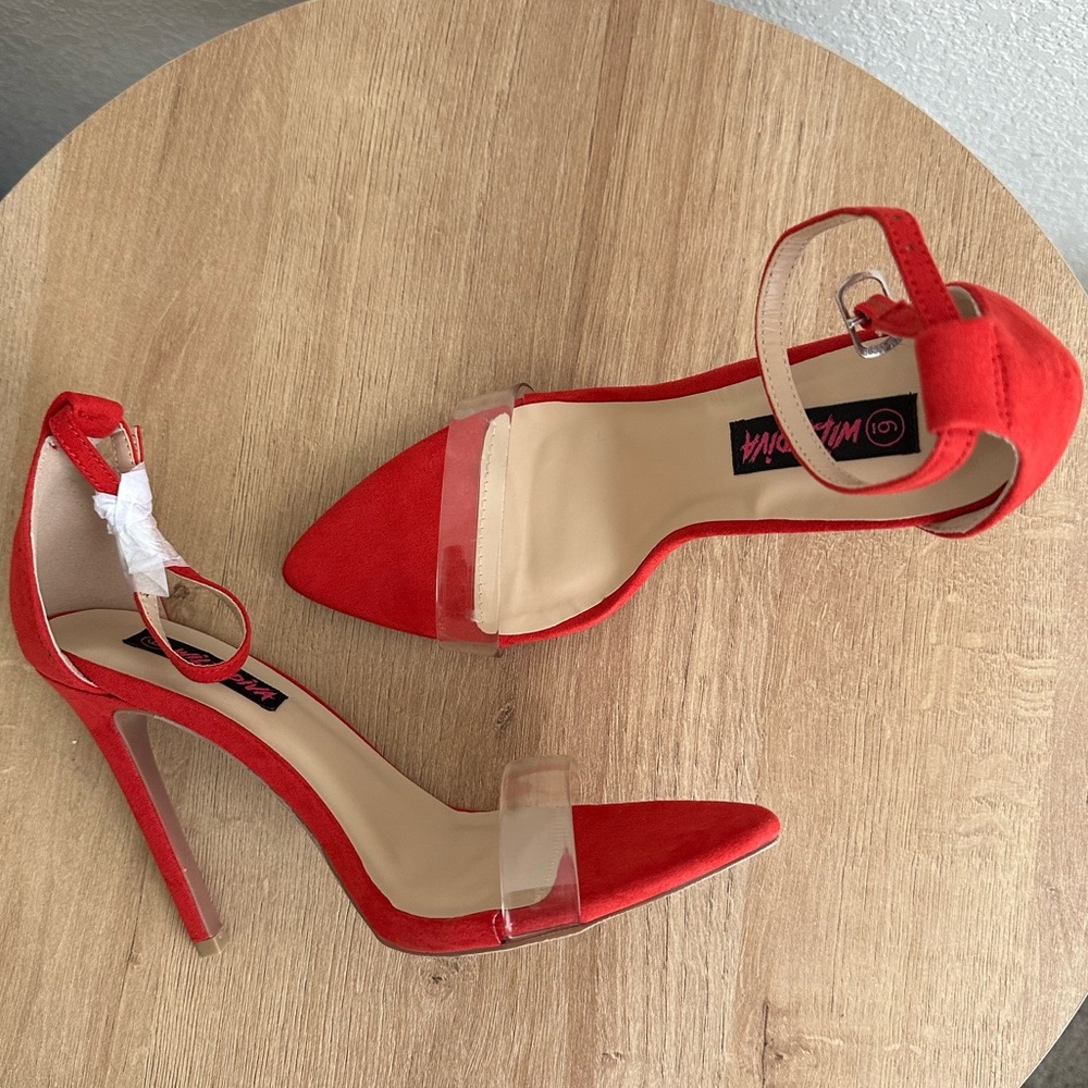 New, red, pointed toe Miss Lola/Wild Diva 5 inch stilettos. Women’s size 6